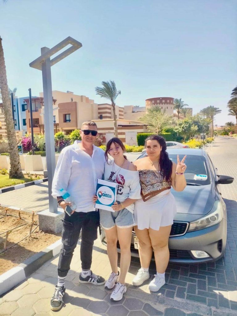 Professional driver helping a tourist with luggage